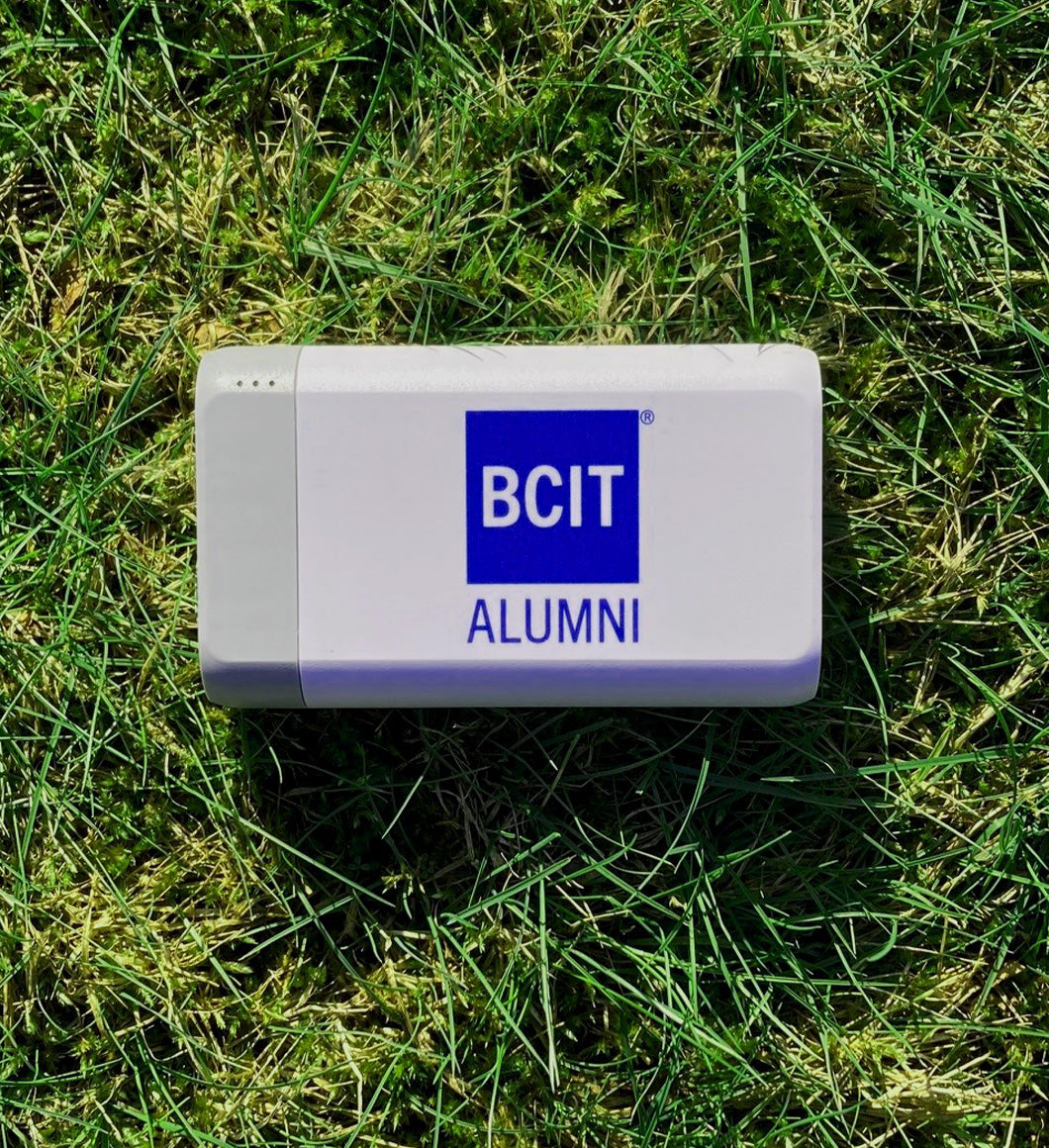 BCIT Alumni blue logo against a white BCIT Alumni SuperNova High-Capacity Portable Charger