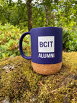 blue mug, BCIT alumni logo, cork base